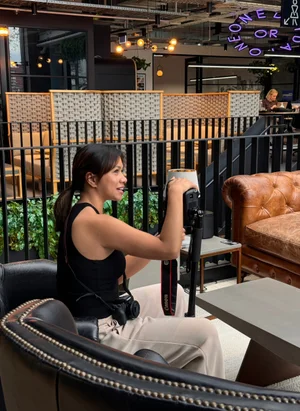 Creative Kubo team member photographing content in a studio space
