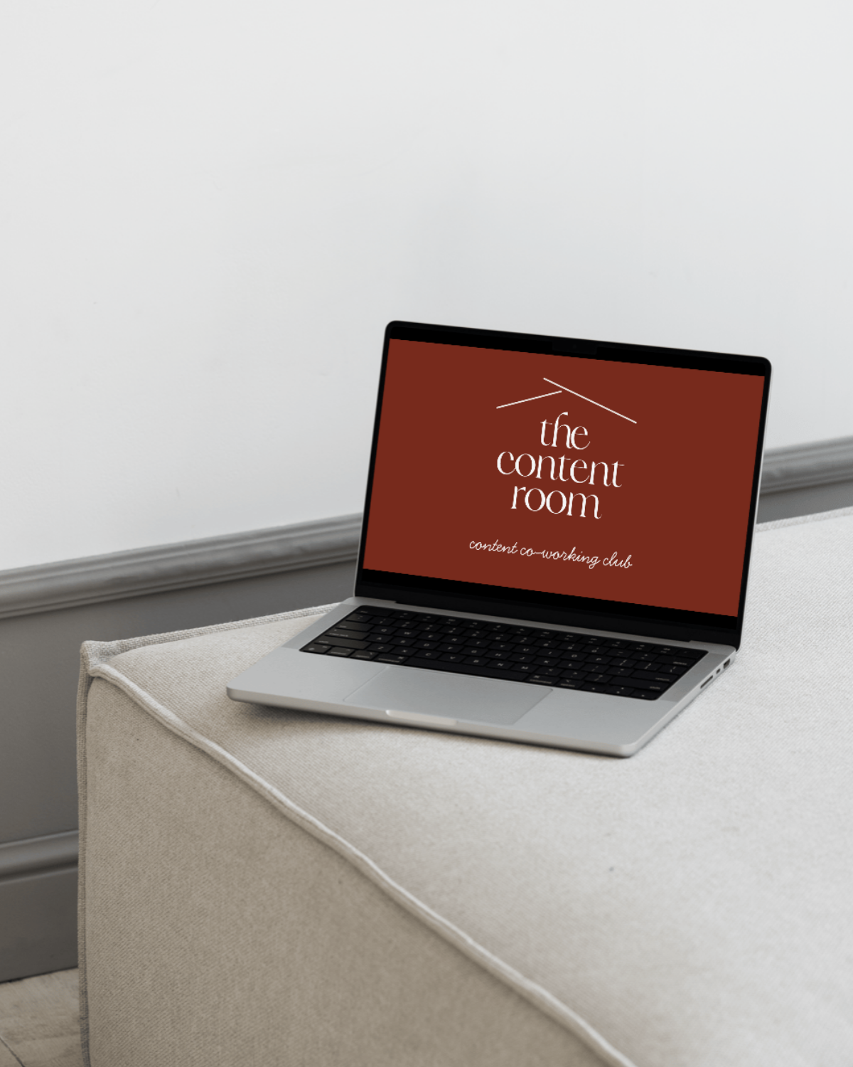 Laptop open on a desk during a content session